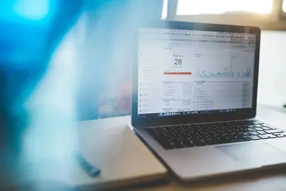 A laptop screen showing a graph in white and blue that shows how to generate more leads to a website.