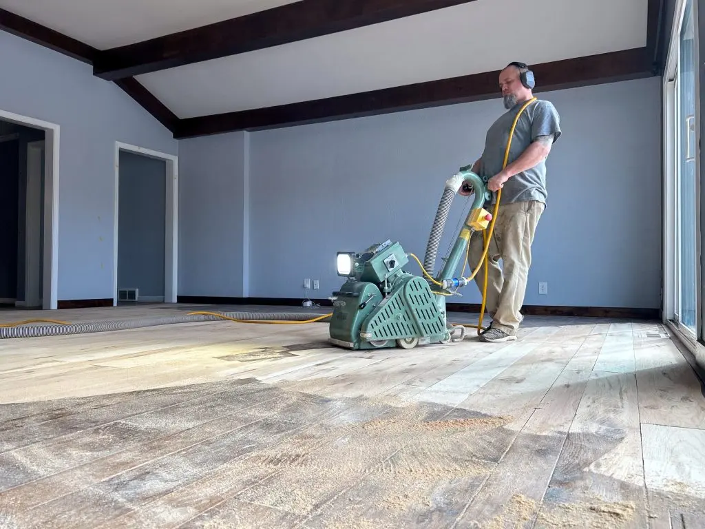 svb wood floors worker doing a refinishing project on a residential home in kansas city