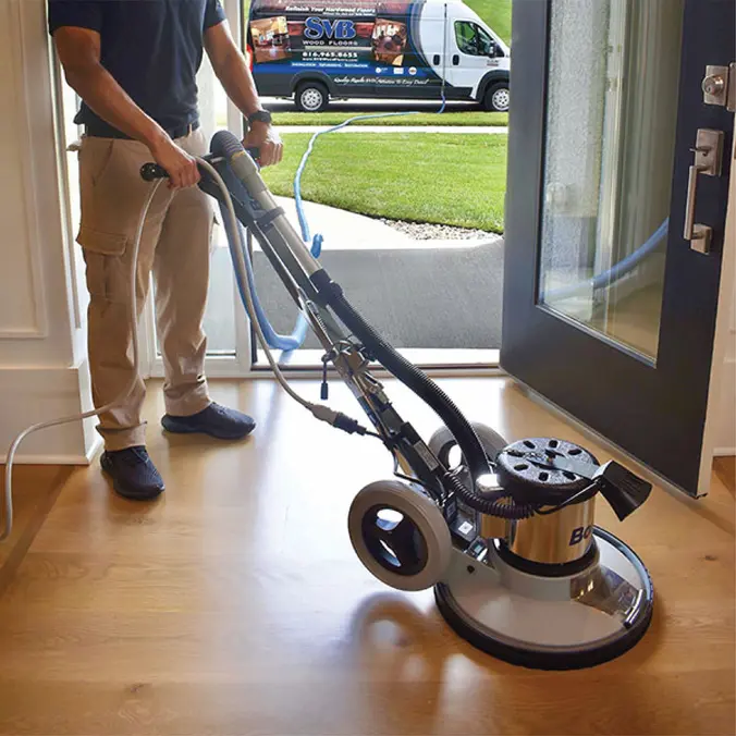 svb contractor doing dustless refinishing on wood floor in entryway of kansas city home
