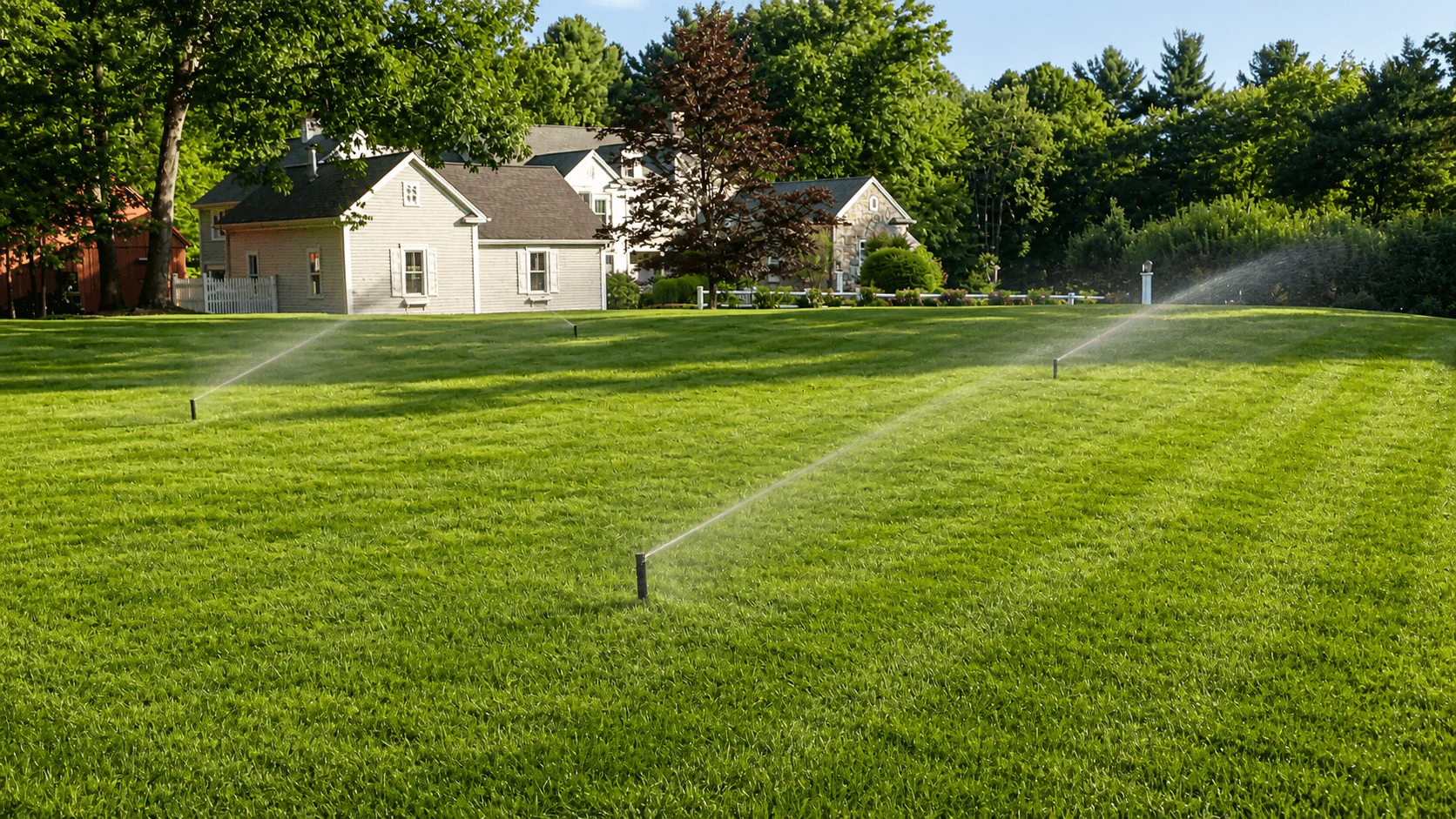 Large scale irrigation system watering commercial property lawn and plants