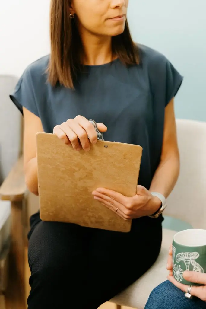 Dr. Aidanne with a clipboard