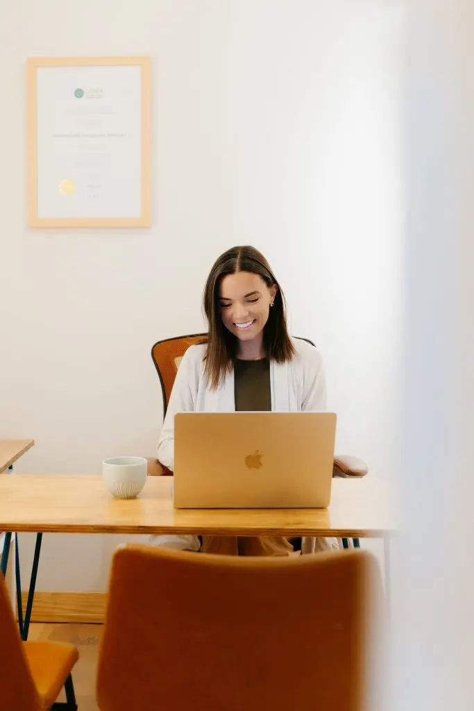 Dr. Aidanne working at her desk inside Wellness Minneapolis