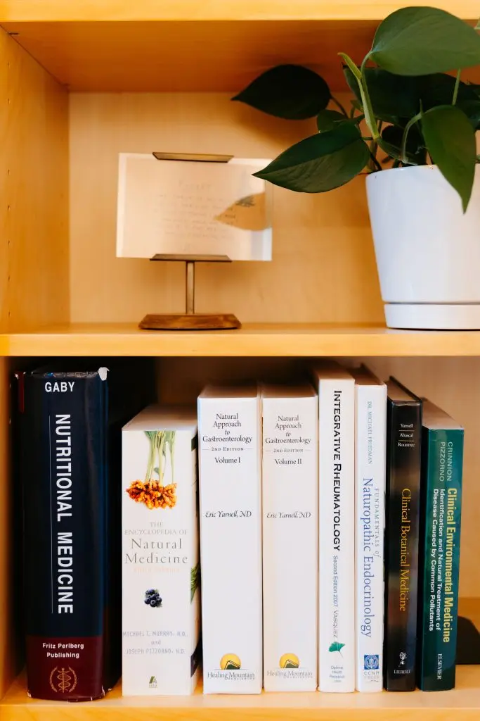 Naturopathic books on a bookshelf