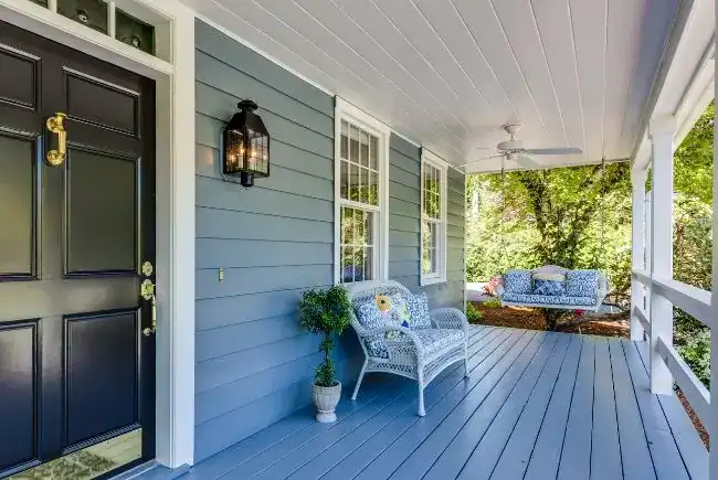 blue gray siding and front porch.