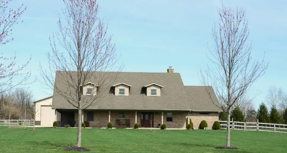 Brick house with dark roof and complementary exterior colors