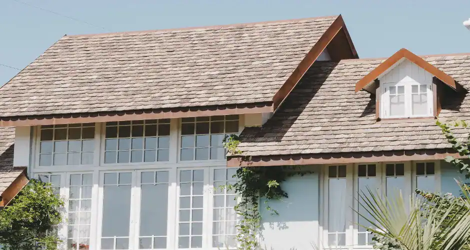 Home with slate roof shingles showing a dark neutral roof color