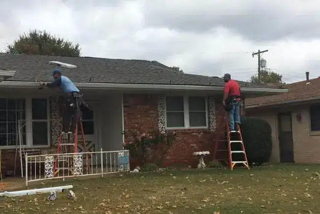maupin roofing team replacing gutters