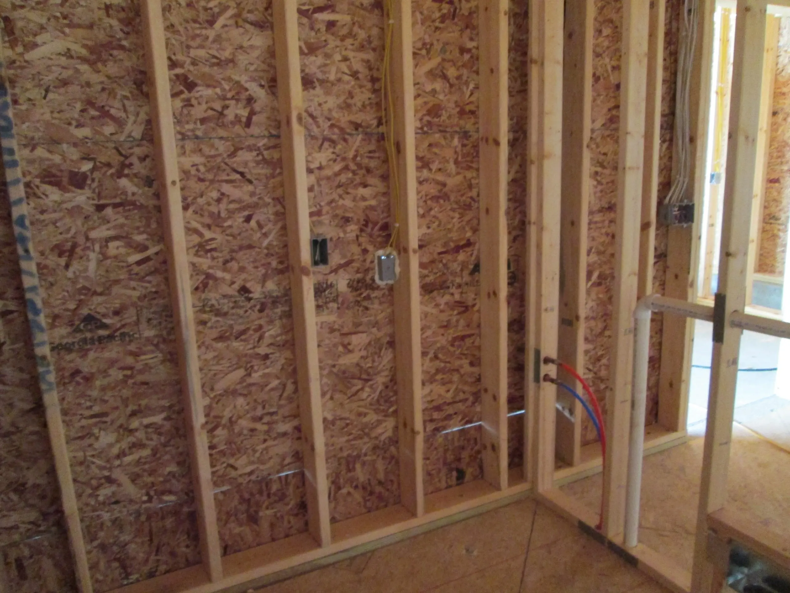 Wall of a house with newly installed insulation
