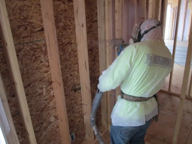 Hometown insulation worker applying coating