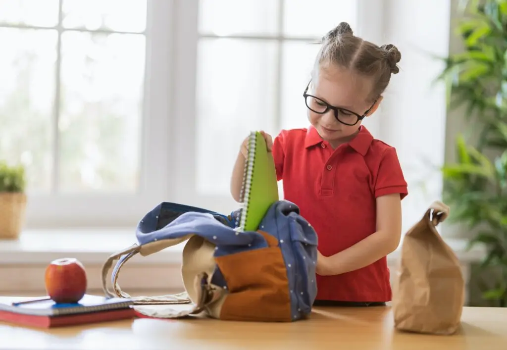 child preparing for school
