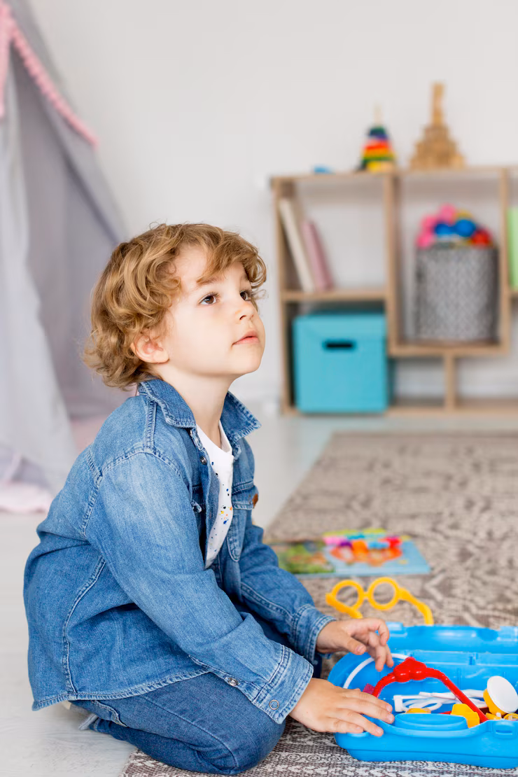 side view boy playing with toys home 23 2148572950
