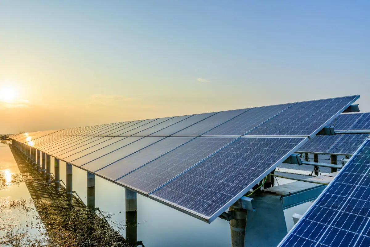 solar panels on top of building sunset