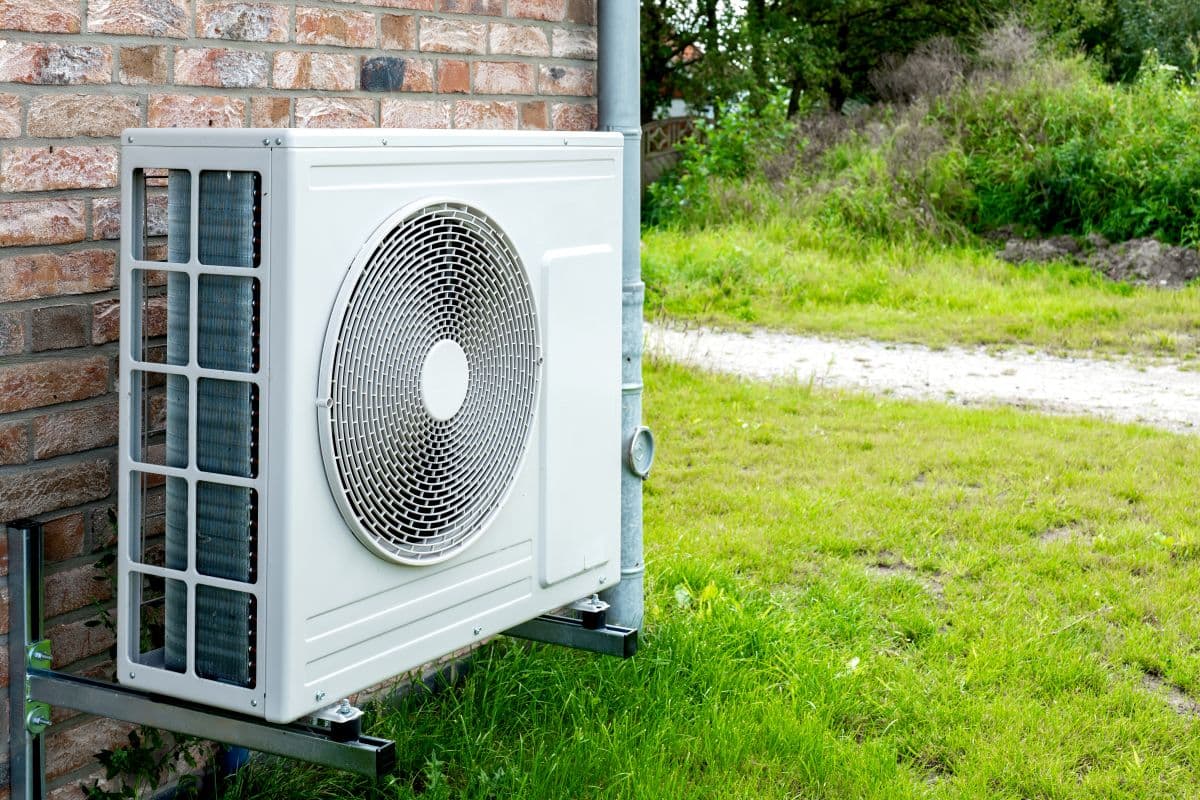 heat pump blowing cold air white unit outside