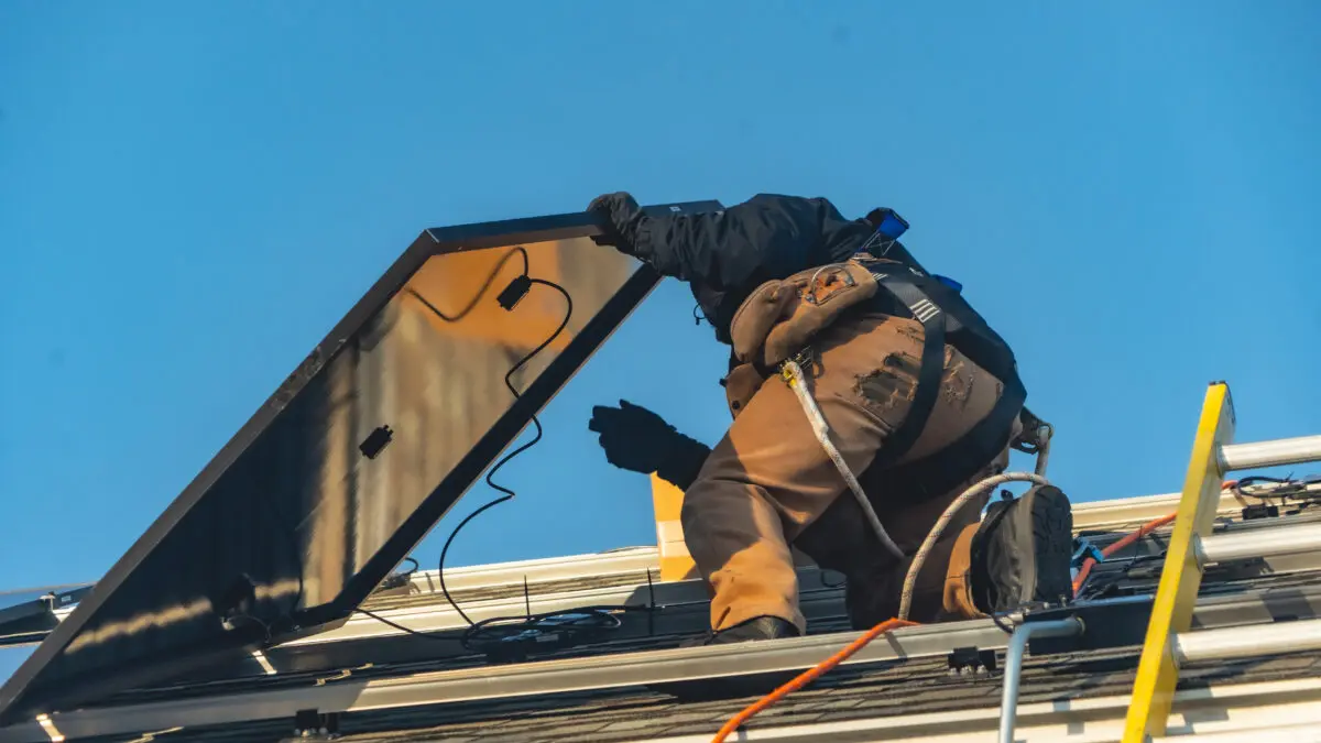 Suncovia worker installing new solar panels
