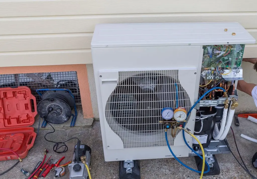 heat Pump. plumber at work installing a circulation pump