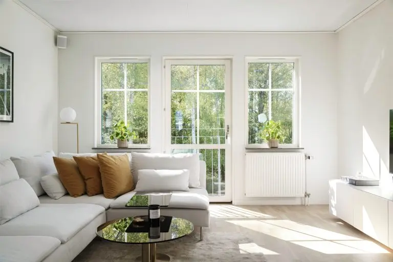 Scandinavian style interior. Living room with bright colors on a sunny summer day.