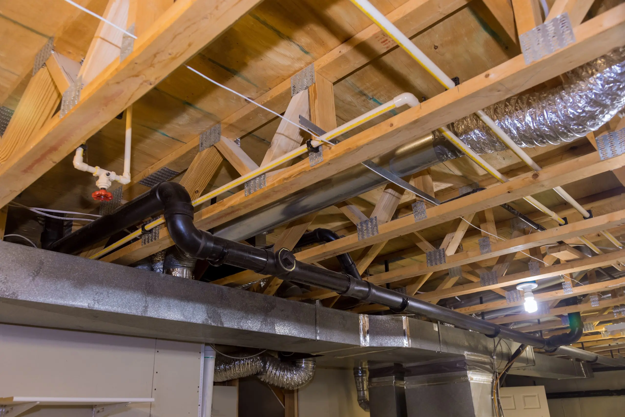 Framed home installation of air conditioner and heating ductwork in ceiling