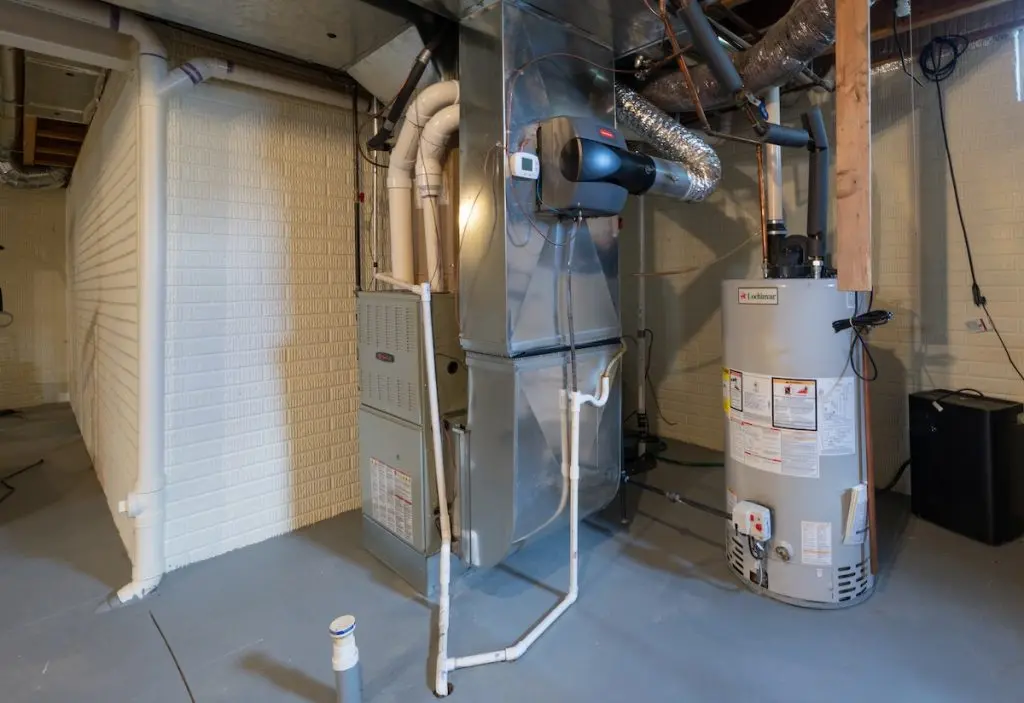 home has been updated with a new residential furnace and hot water tank installed in the basement