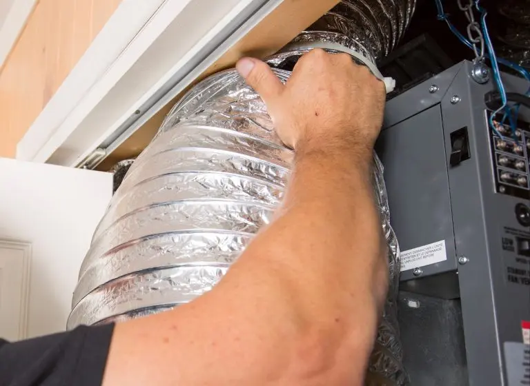 A ventilation cleaner man at work with tool