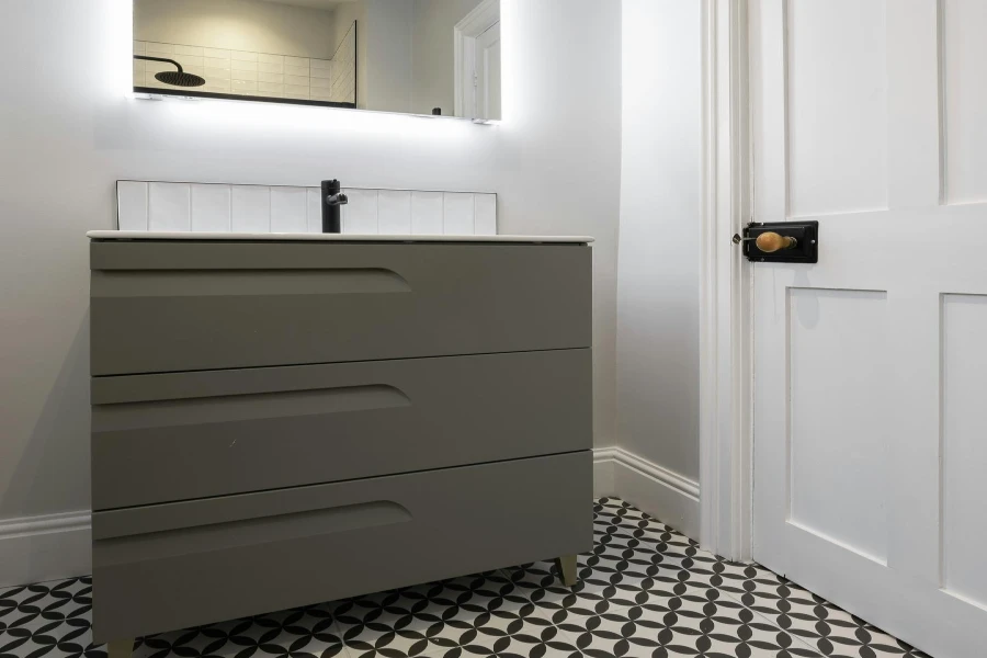 bathroom with black and white checkered floor tile