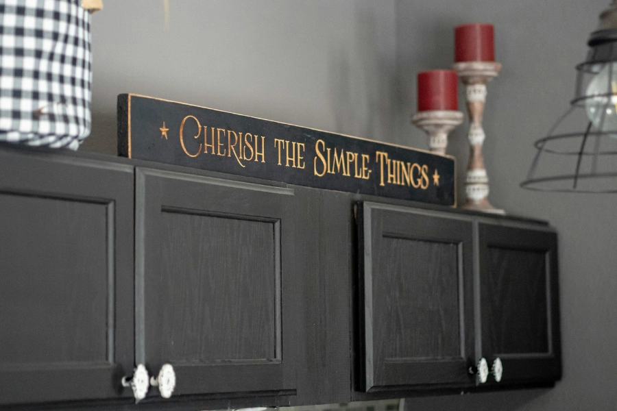 Wall cabinets with black cabinet doors.