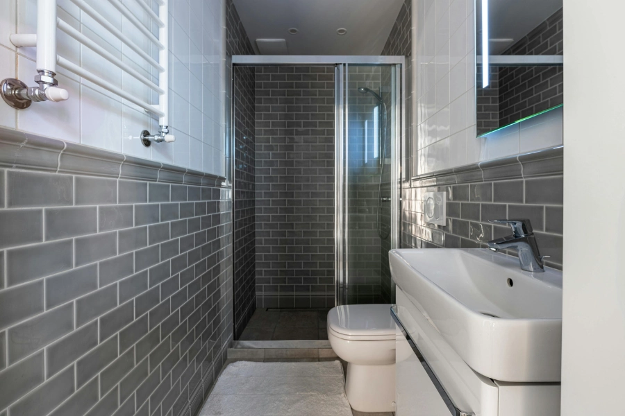 Bathroom with gray subway tiles.