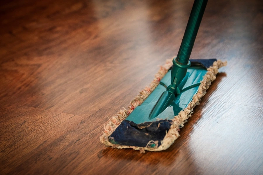 Mopping dark hardwood floors.