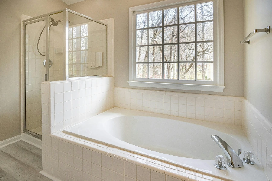 window beside bathtub and shower