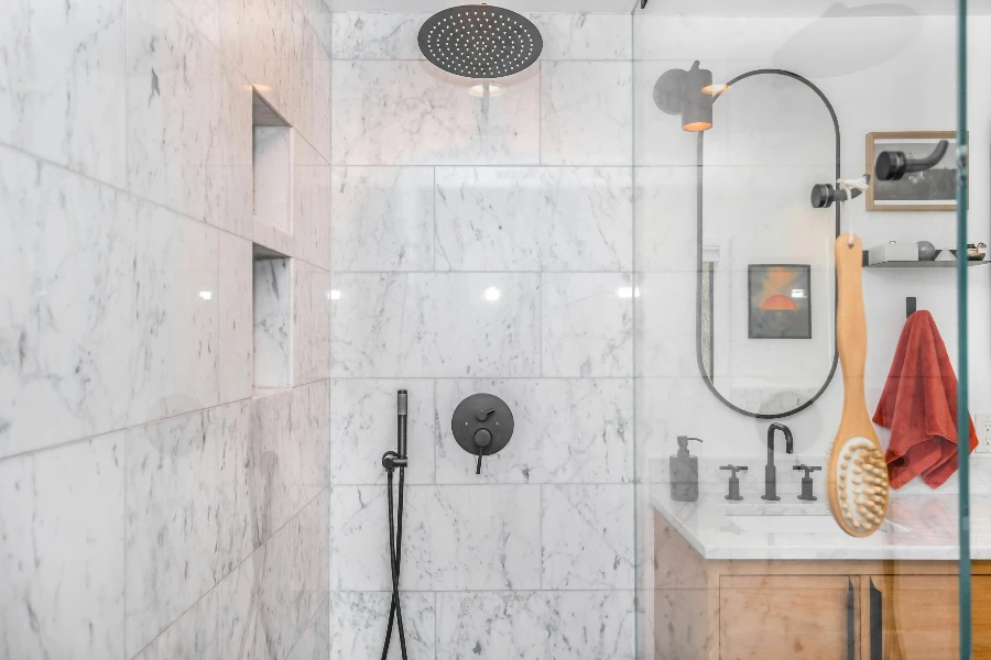 modern bathroom shower with black fixtures and white wall tile