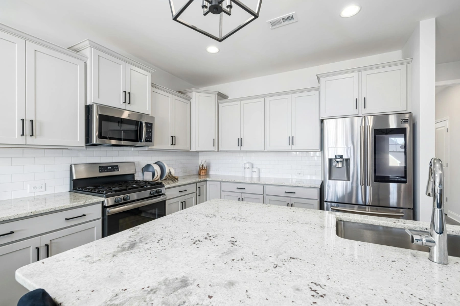 A cozy kitchen setup highlighting zones for cooking, preparation, and dishwashing.