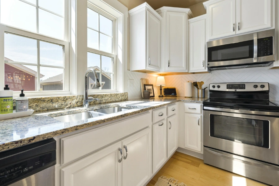 A compact sink placed under a window.