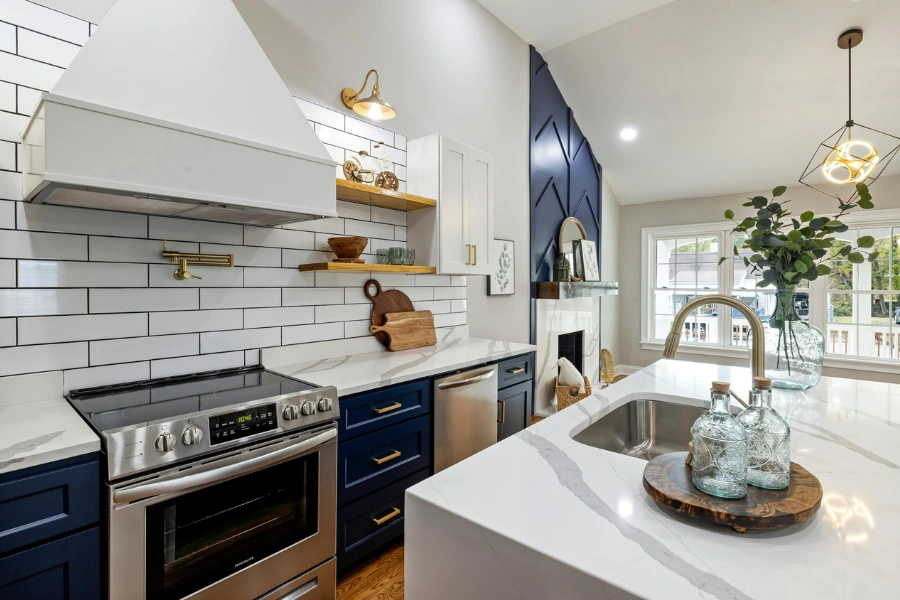 A kitchen sink on a marble kitchen island.