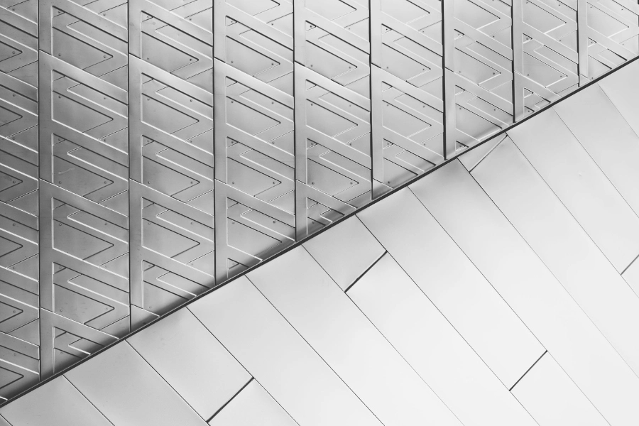 grayscale photo of metal tile flooring
