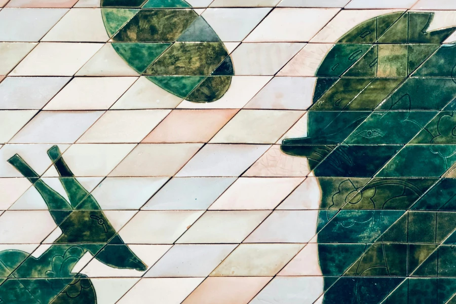 a close up of a tiled wall with a silhouette of a person holding an umbrella
