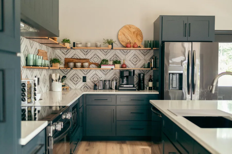 deep set kitchen with herringbone tile backsplash