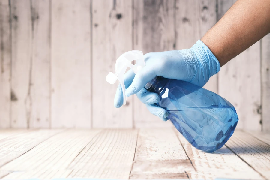person holding a spray bottle