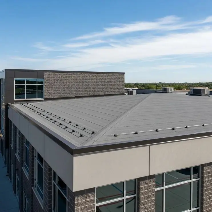 Modified bitumen roofing system on a commercial building in Fort Worth, showcasing durability and weather resistance, with a clear blue sky in the background.
