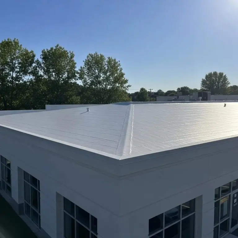 Commercial building with a newly installed spray foam roof showcasing energy efficiency