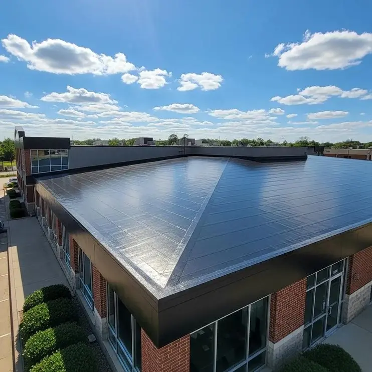 EPDM roofing installation on a commercial property in Fort Worth, showcasing a flat, durable rubber roof under a clear blue sky.