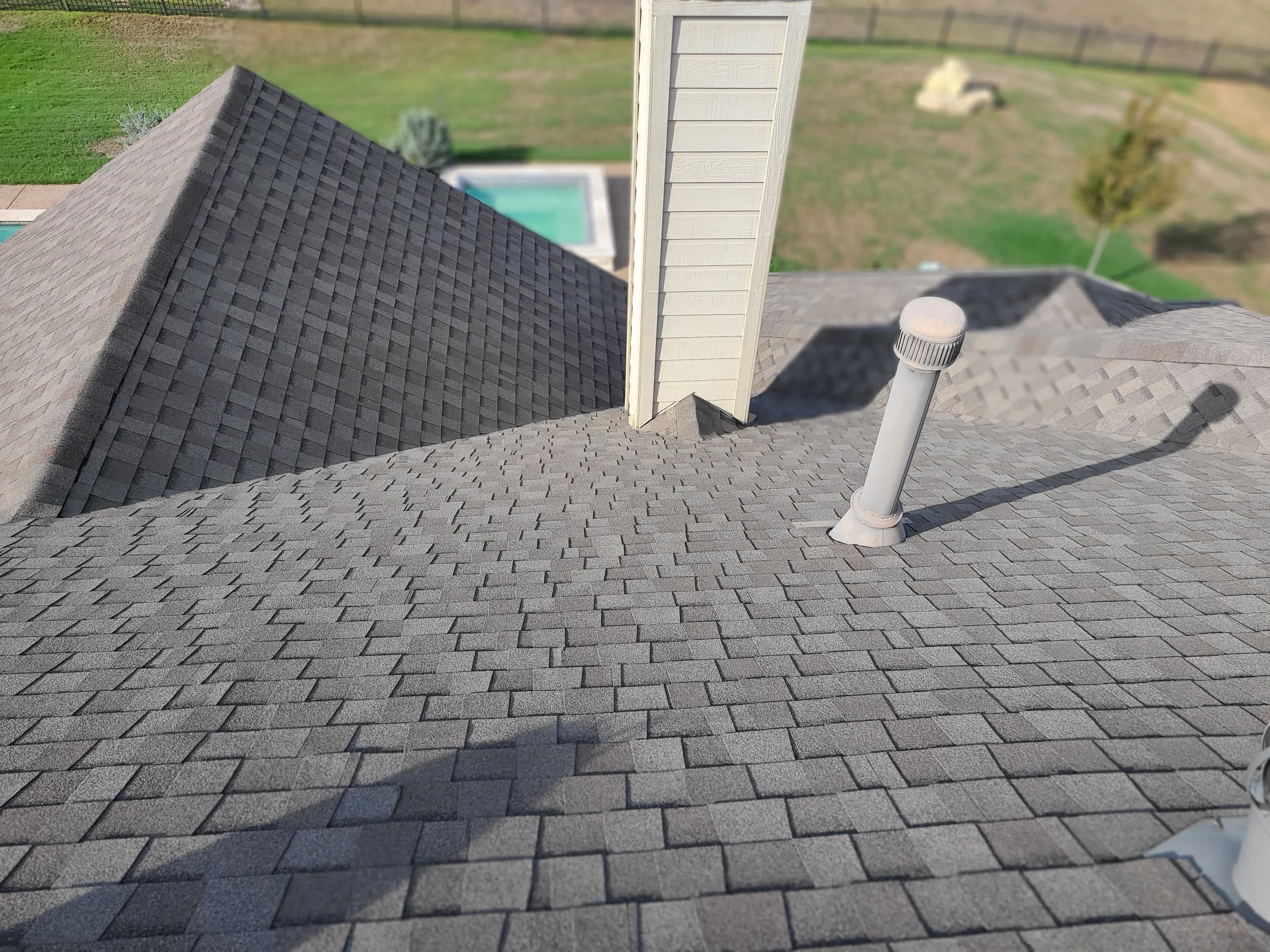 Texcore crew completing an asphalt shingle roof replacement near Frisco, TX