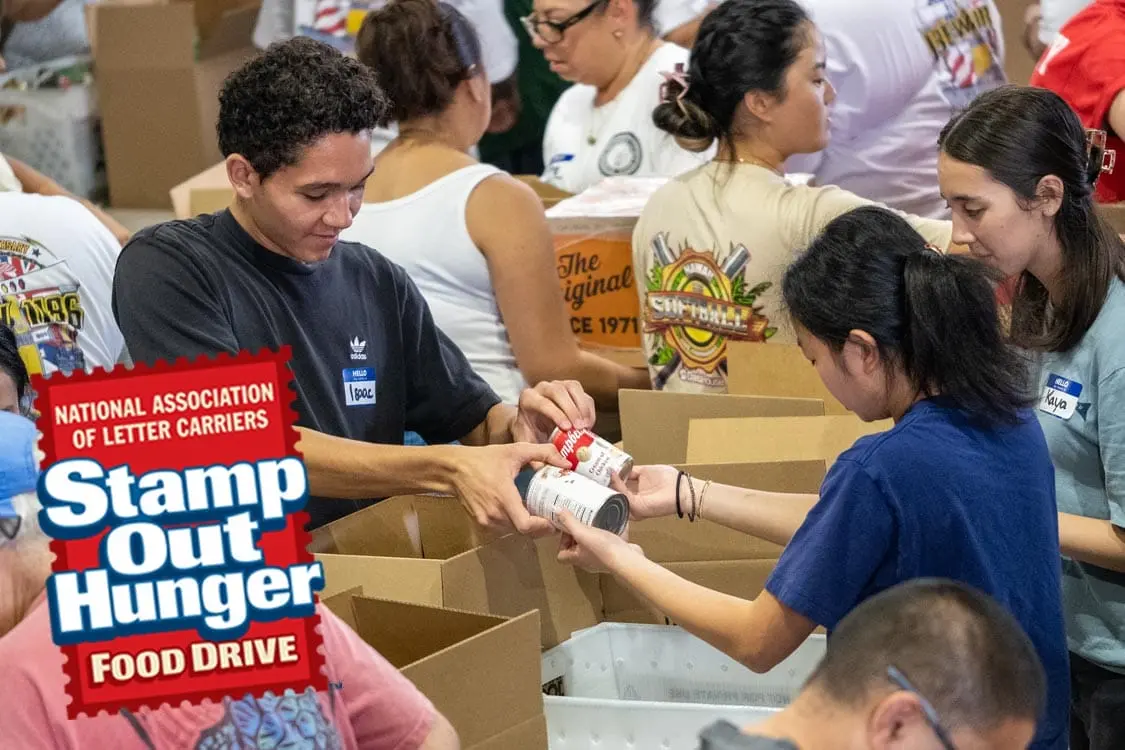HawaiiFoodbank_StampOutHunger_Warehouse Volunteers pack canned goods at Hawaii Foodbank Stamp Out Hunger food drive