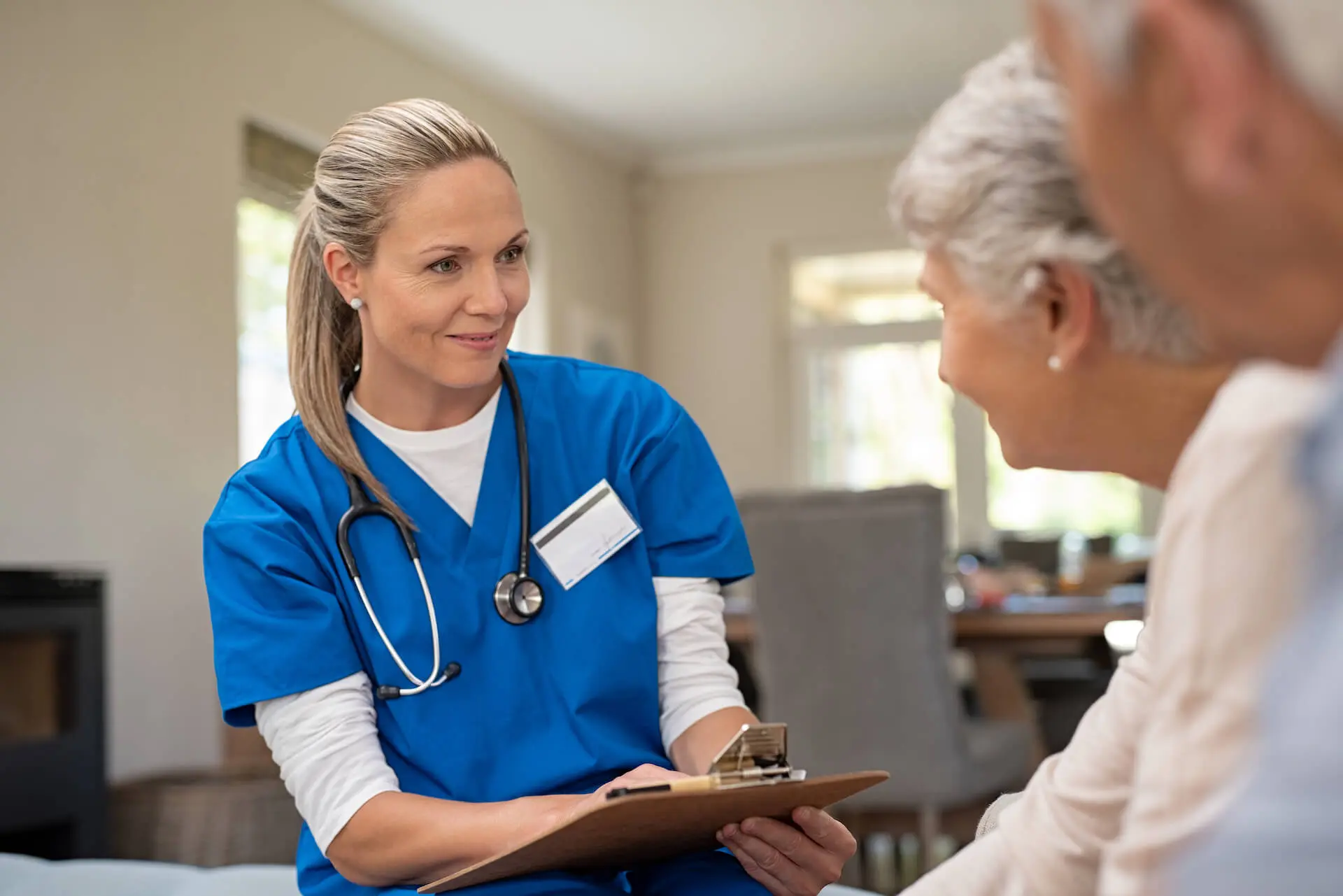 A Healthcare Professional Attending to Two Patients in Home Healthcare in Loveland, CO