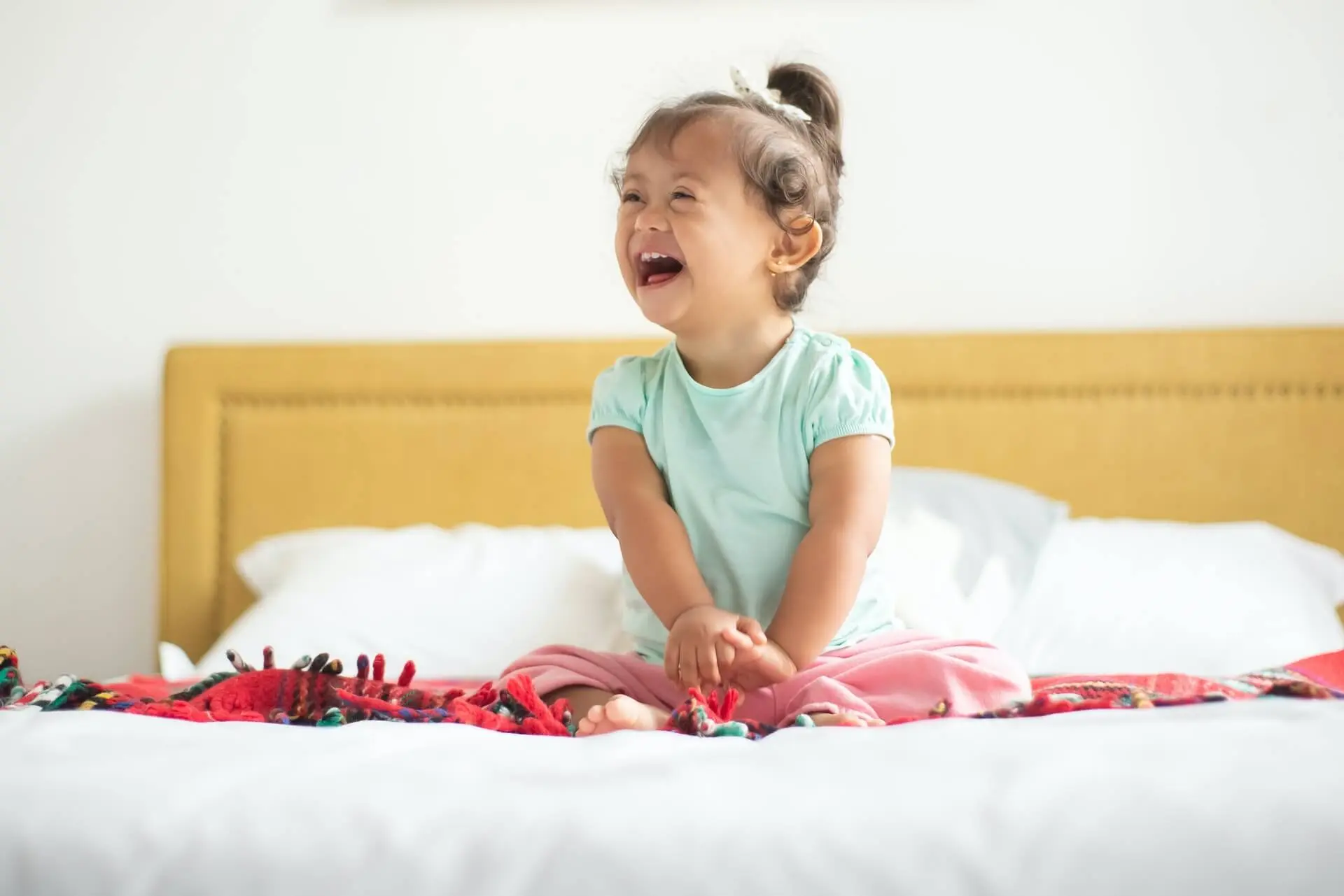 A Happy Child Sitting in Kids First Pediatric Homecare