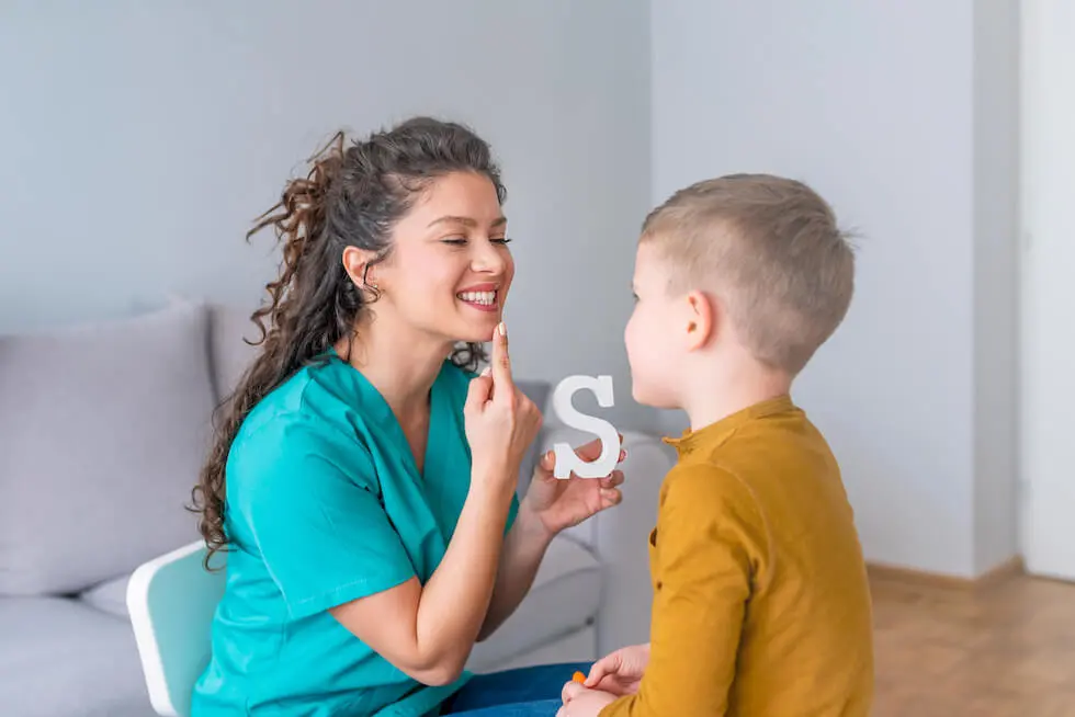 Speech therapist working with child