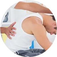 Person receiving back massage therapy session.