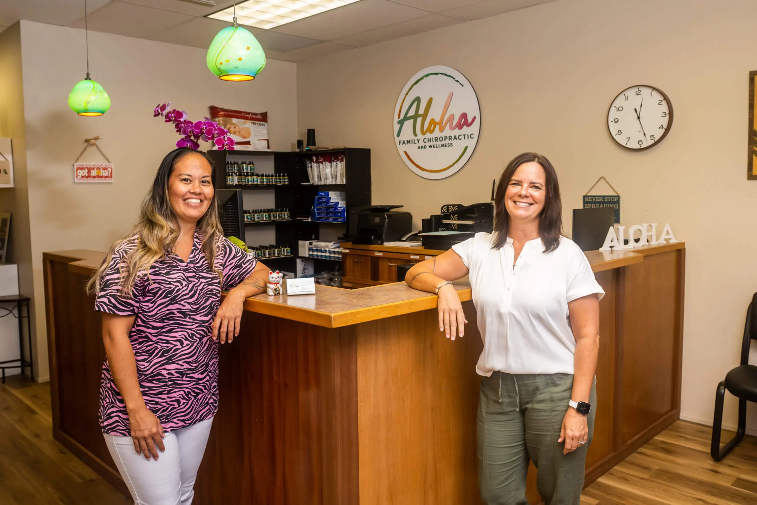 Two Women Standing By A Wooden Counter Space