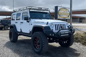 Top-Rated Off-Road Shop in Grand Junction, CO at Barney Brothers Off Road & Repair. Image of lifted Jeep Wrangler Rubicon with off-road upgrades, showcasing suspension, tire, and performance enhancement services.