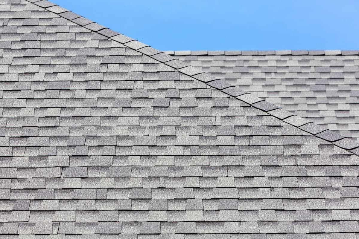 grey asphalt shingle roof with ridge cap shingles