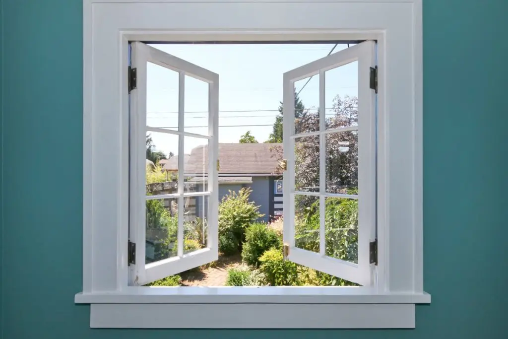 Open casement window to the back yard with small shed.