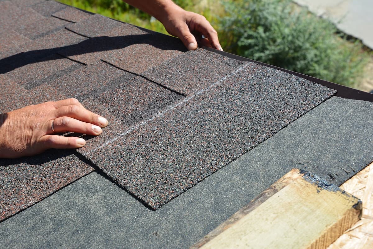 Roofer Contractor Installing Asphalt Shingles